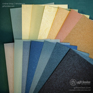 Assorted metallic shimmering scrapbook paper sheets in four seasons theme