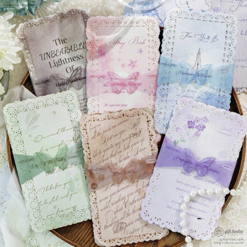 Elegant lace-edged vintage quote cards in soft pastel shades displayed with flowers
