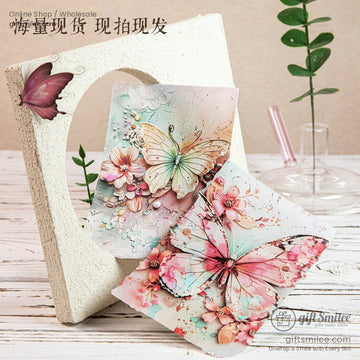3D butterfly and pink floral scrapbooking paper displayed on a rustic wood table