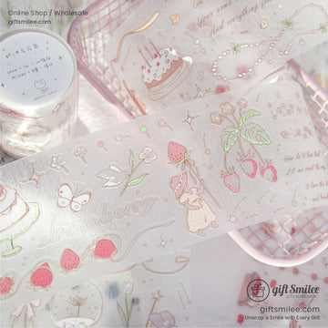 Close-up of strawberry and bunny-themed washi tape with pastel designs