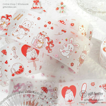 Close-up of kawaii pastel washi tape rolls featuring cute teddy bears, cherries, and bows