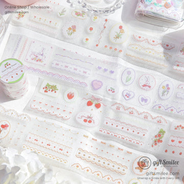 Close-up of pastel floral and bunny-themed washi tape rolls