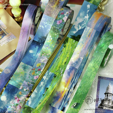 Elegant washi tape rolls with landscape designs showcasing fields, skies, and floral details