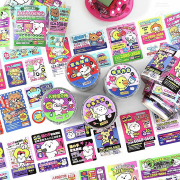 A colorful assortment of kawaii Japanese cartoon character stickers spread across a white surface