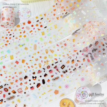 Close-up of kawaii food-themed washi tape with donuts, chocolates, and pastel sweets