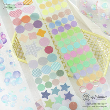 Close-up of holographic washi tape featuring pastel dots, stars, and glitter effects