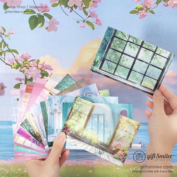 Hand holding aesthetic window view postcards with floral backgrounds and scenic designs