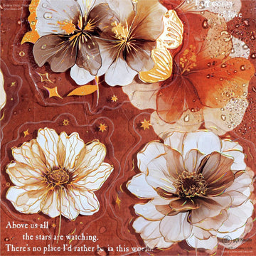 A close-up of vintage-inspired floral stickers featuring delicate flowers with golden details and star motifs.