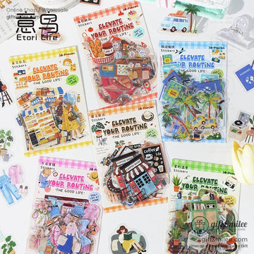 A collection of Elevate Your Routine decorative sticker packs with various daily life themes on a white table
