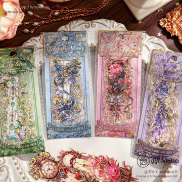 Elegant gold foil floral stickers featuring vintage designs on a decorative plate