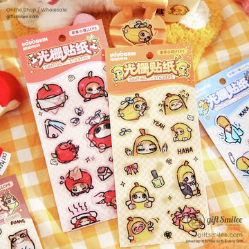 Close-up of yellow banana-themed grating stickers with Yeah and Haha captions