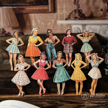 Close-up of vintage pin-up girl stickers on a rustic wooden table