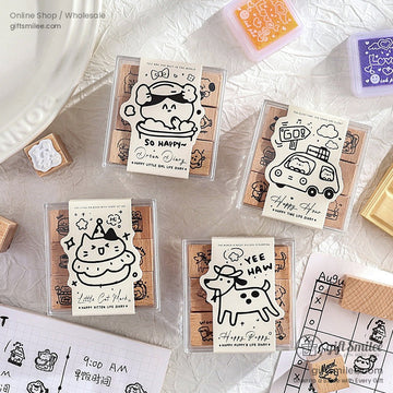 Wooden rubber stamps with cute cartoon designs displayed in a plastic box.