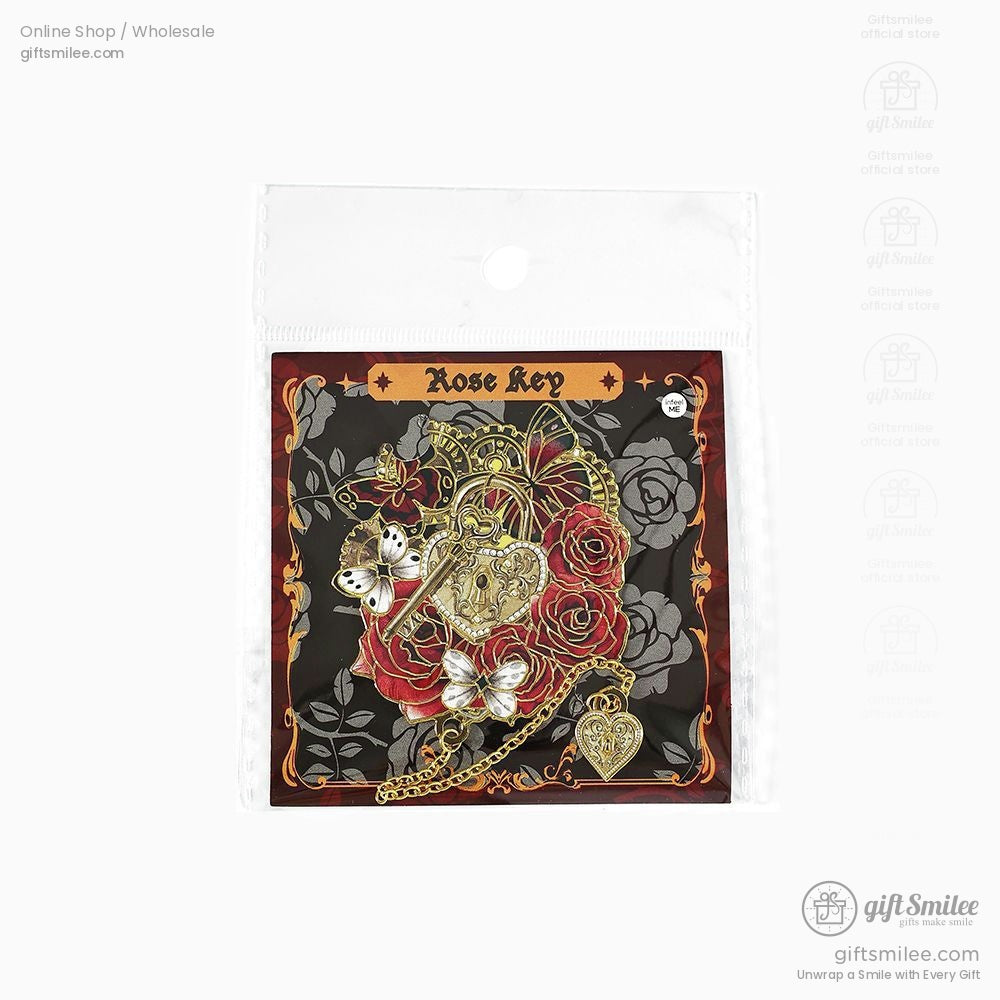 Packaged Victorian rose brooch with butterfly and key charm design