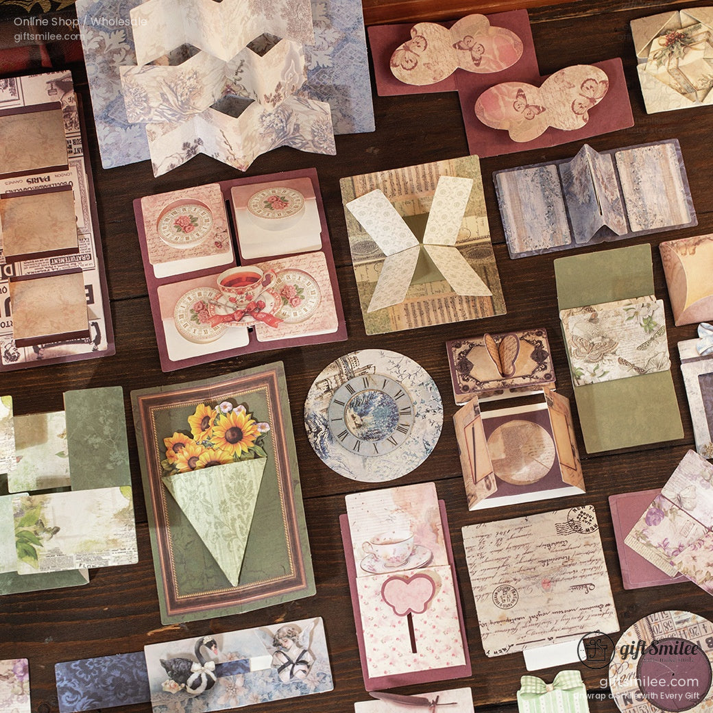Close-up of decorative paper cutouts and journaling materials in various antique-inspired patterns