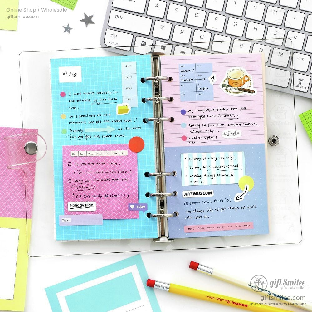 Open planner with vibrant paper designs used for aesthetic journaling