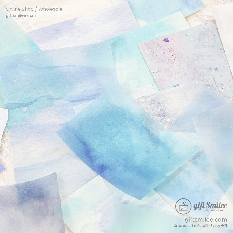 Blue watercolor paper sheets featuring gradient hues and subtle artistic splashes for creative projects
