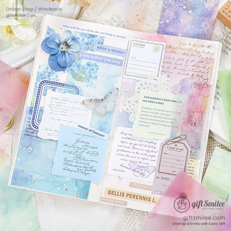 Open journal showcasing mixed pastel and floral-themed paper used for aesthetic scrapbooking