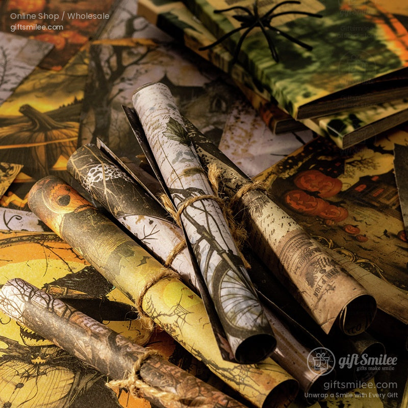 Rolled Halloween scrapbook paper with intricate vintage designs tied with twine