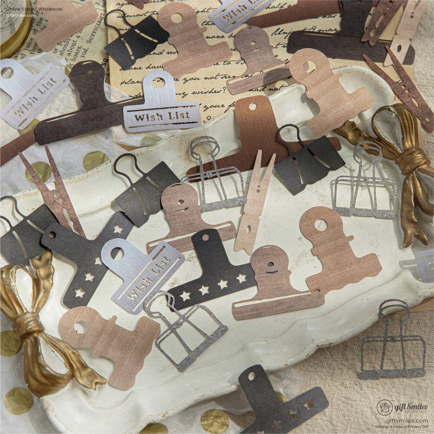 Assorted vintage clamps and paper clips displayed on a rustic tray, ideal for creative journaling