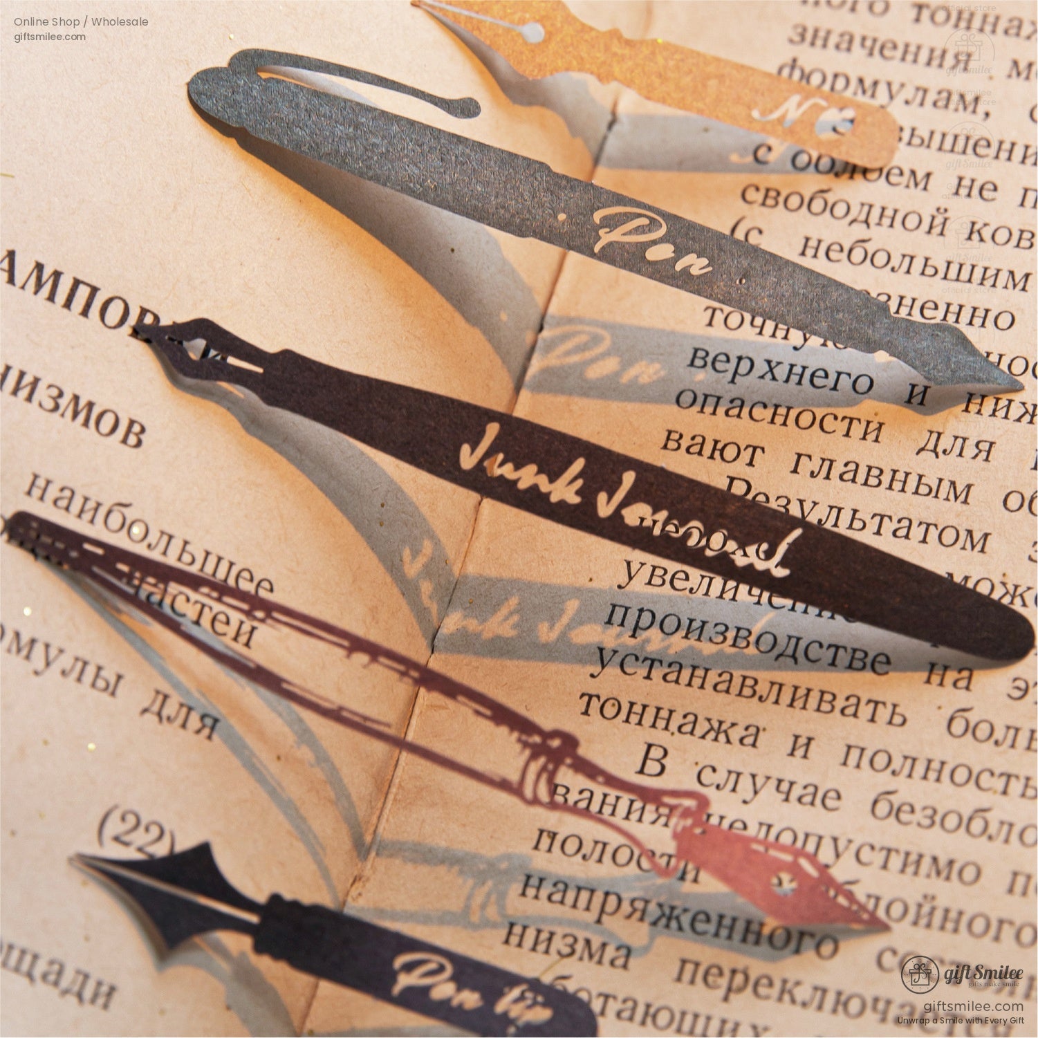 Close-up of vintage pen-shaped embellishments on an old book background, adding a retro touch to crafting projects