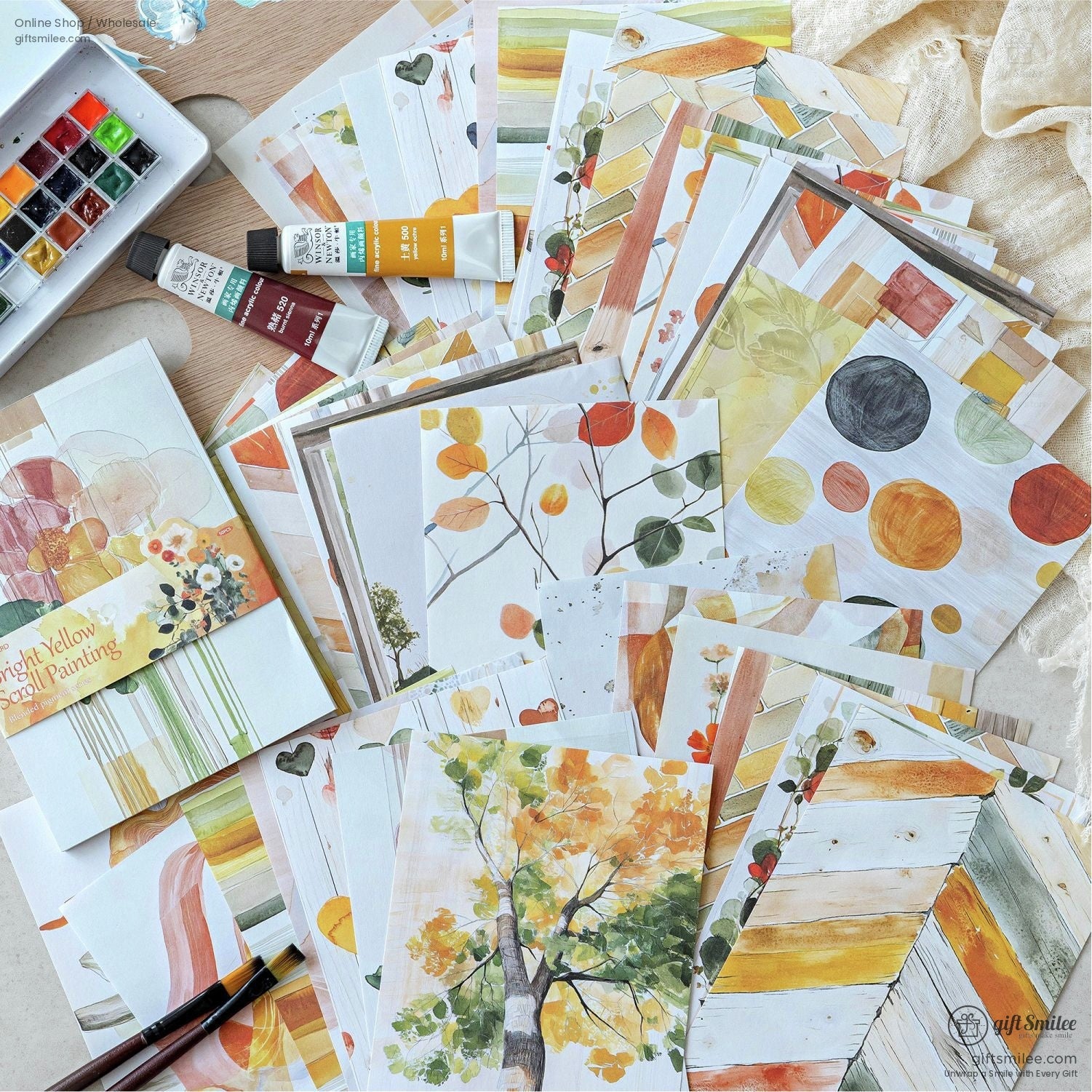 Autumn-themed watercolor paper set with vibrant leaves and warm tones for crafting