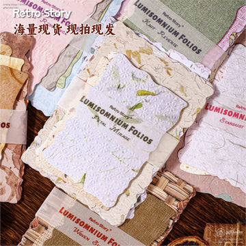 Close-up of Retro Story Lumisomnium Folios paper set with floral and textured designs