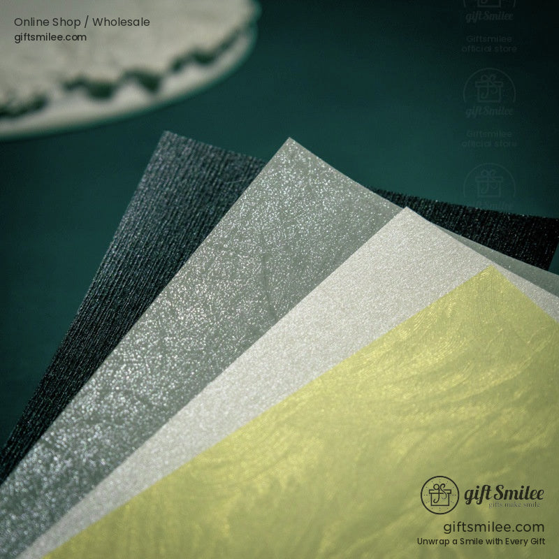 Close-up of metallic shimmer texture on scrapbook paper in golden and silver hues