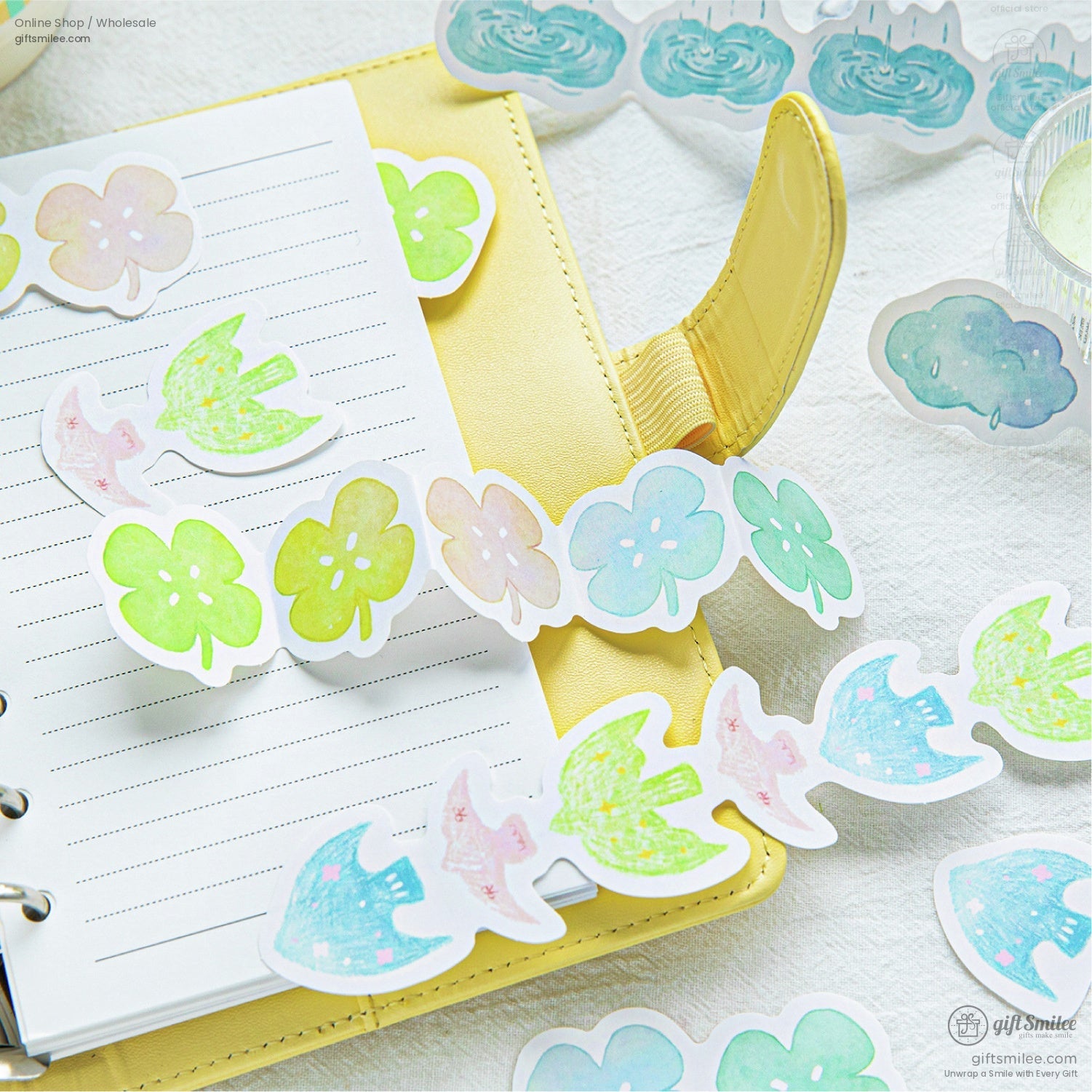 Nature and flower stickers displayed with a yellow notebook, perfect for journaling