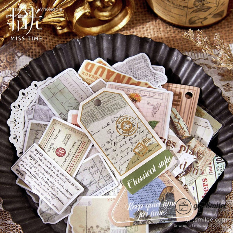 A vintage-themed scrapbook kit featuring two retro-style material packages with intricate designs