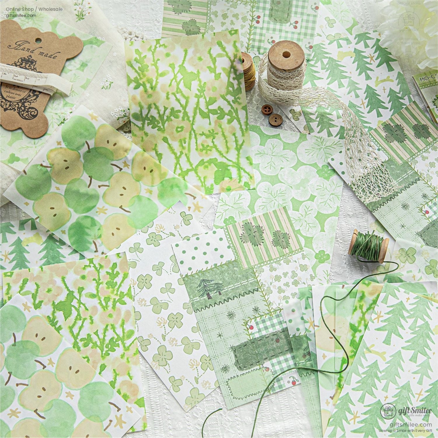 Green-themed scrapbook paper with pastel apple, clover, and foliage patterns for crafting