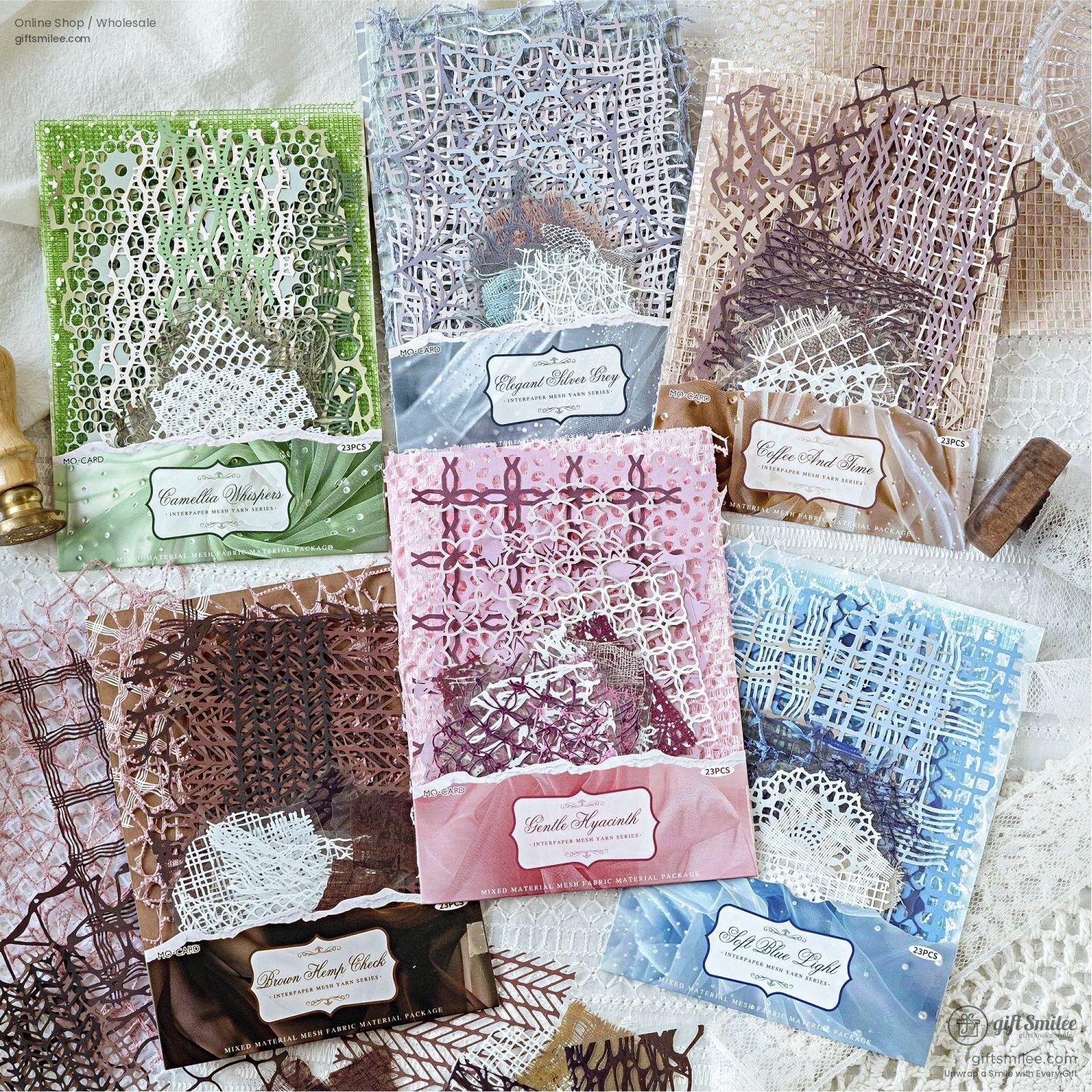 Six neatly packaged vintage-inspired mesh scrap packs for junk journaling