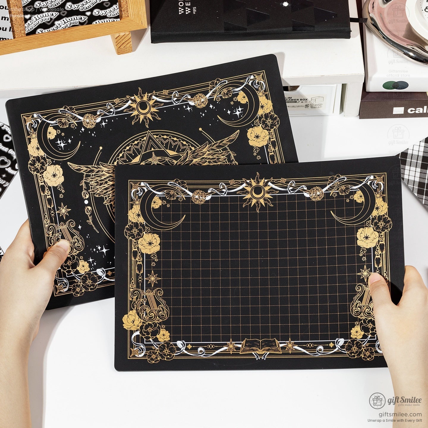 Two celestial-patterned craft mats with gridlines for precision cutting.