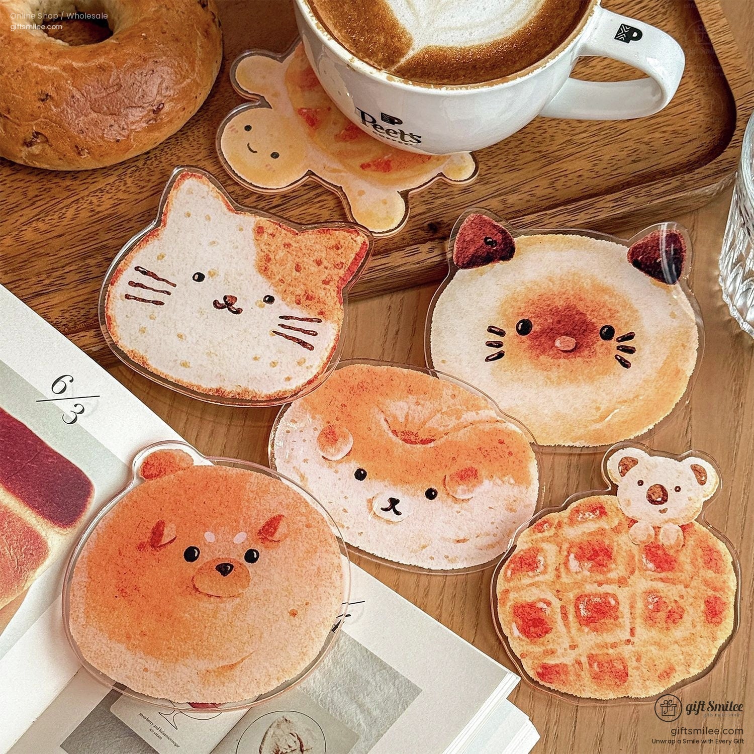 Set of animal-shaped coasters featuring cat, bear, and waffle designs on a wooden table