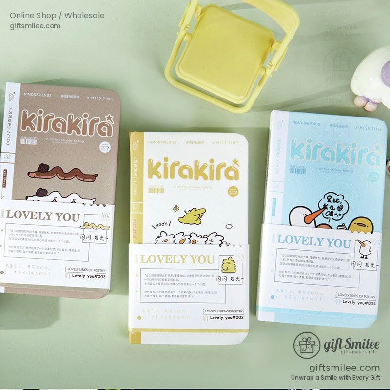 A set of three colorful Kirakira Lovely You journals featuring whimsical illustrations in pastel tones