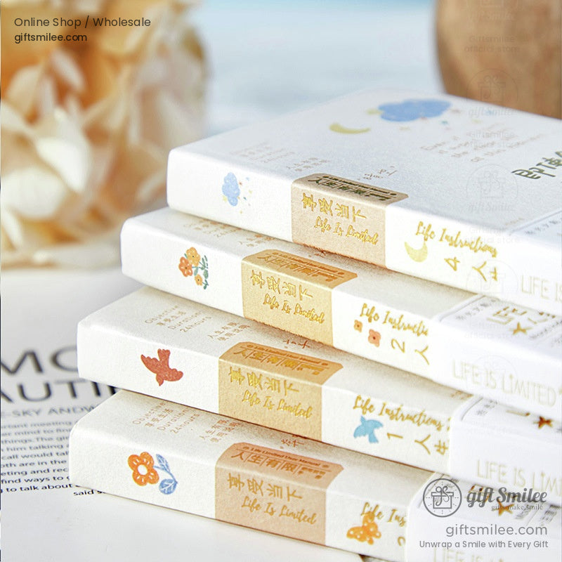 A stacked view of Life is Limited notebooks with floral and nature-inspired designs