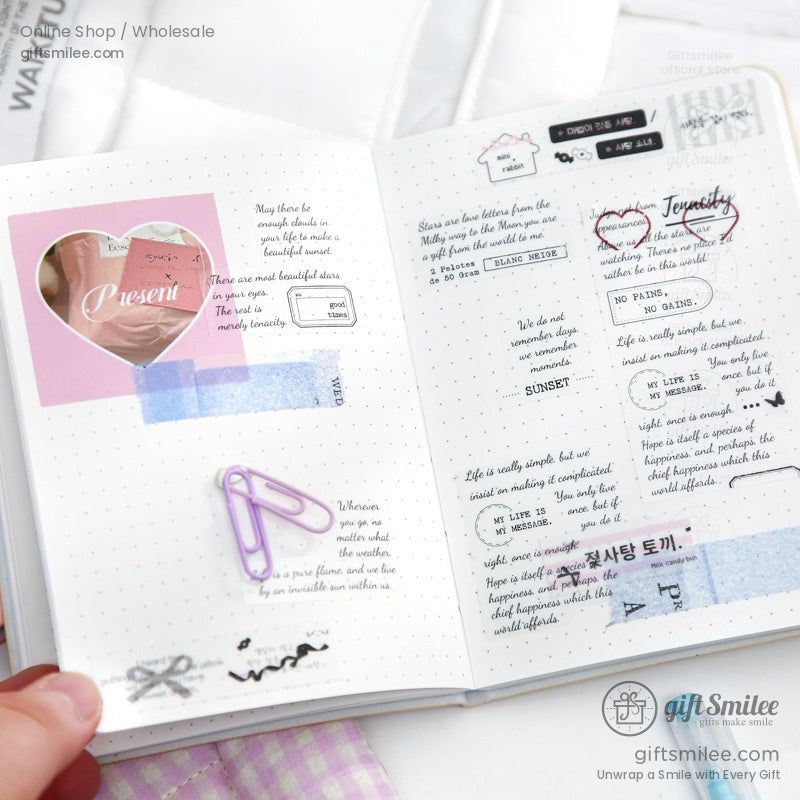 Inside view of a puppy-themed notebook with decorated pages, stickers, and writing prompts