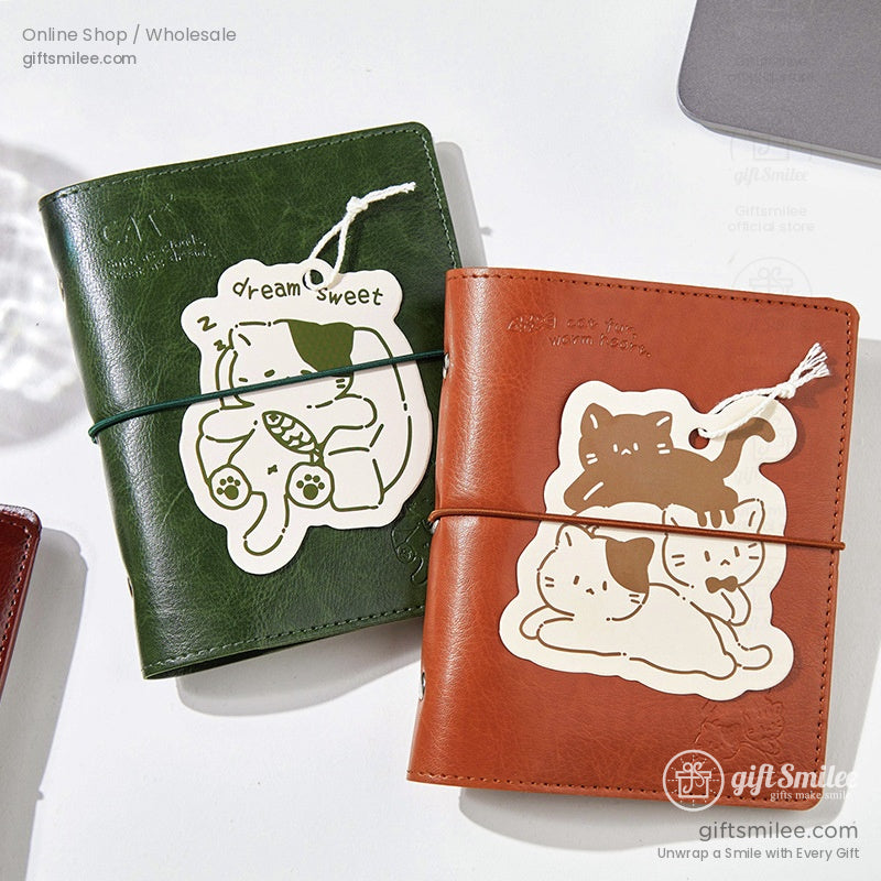 Green leather journal with a sleeping cat tag labeled Dream Sweet