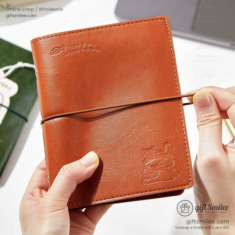 Green leather journal with a sleeping cat tag labeled Dream Sweet