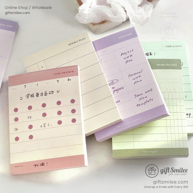 Collection of pastel planner pads including goal tracker and to-do list sheets