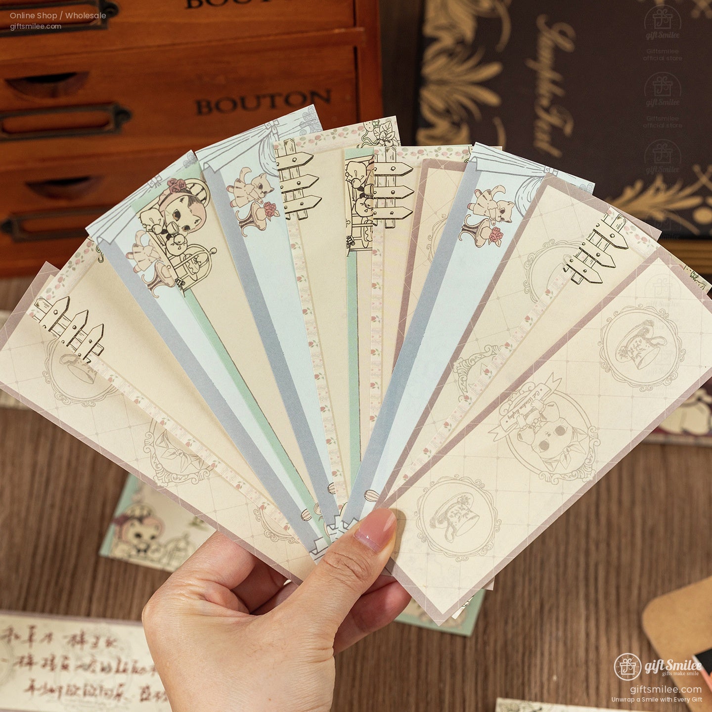 Fan display of pastel-colored memo pads featuring adorable cats and elegant vintage motifs