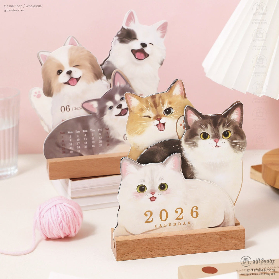 Cute 2026 desktop calendar featuring cats and dogs with a wooden stand