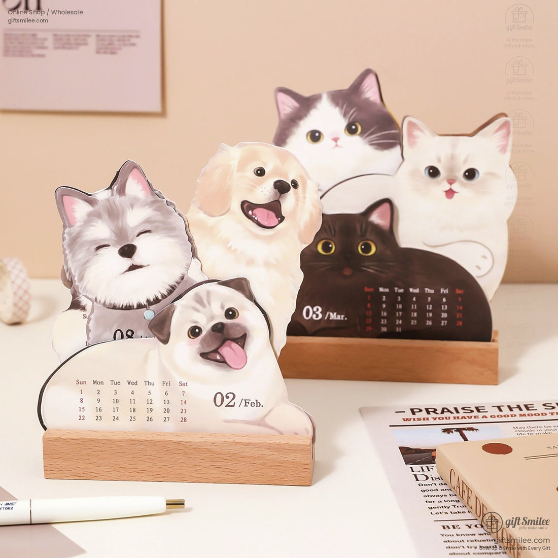 Cute 2026 desktop calendar featuring cats and dogs with a wooden stand