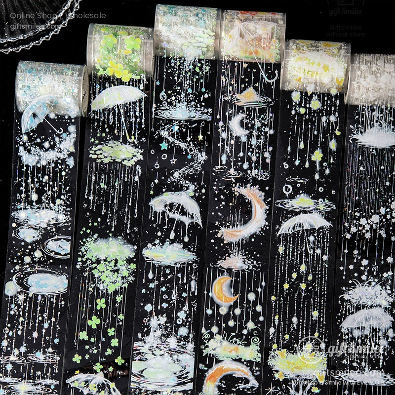 A full set of celestial-themed washi tape rolls with designs of umbrellas, stars, rain, and glowing accents