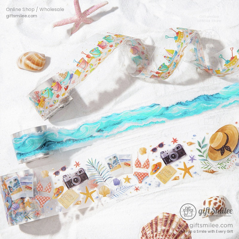 Decorative washi tape rolls with vibrant beach-themed designs, including cameras, starfish, hats, and beach waves.