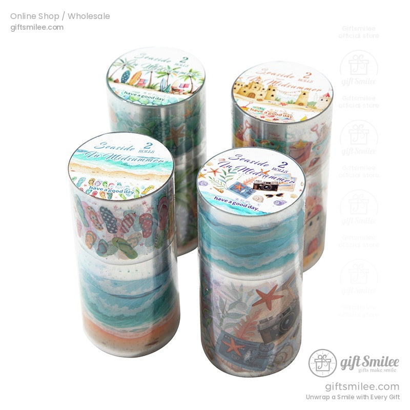 A full set of seaside-themed washi tapes in cylindrical packaging, featuring sandcastle and ocean-inspired motifs.