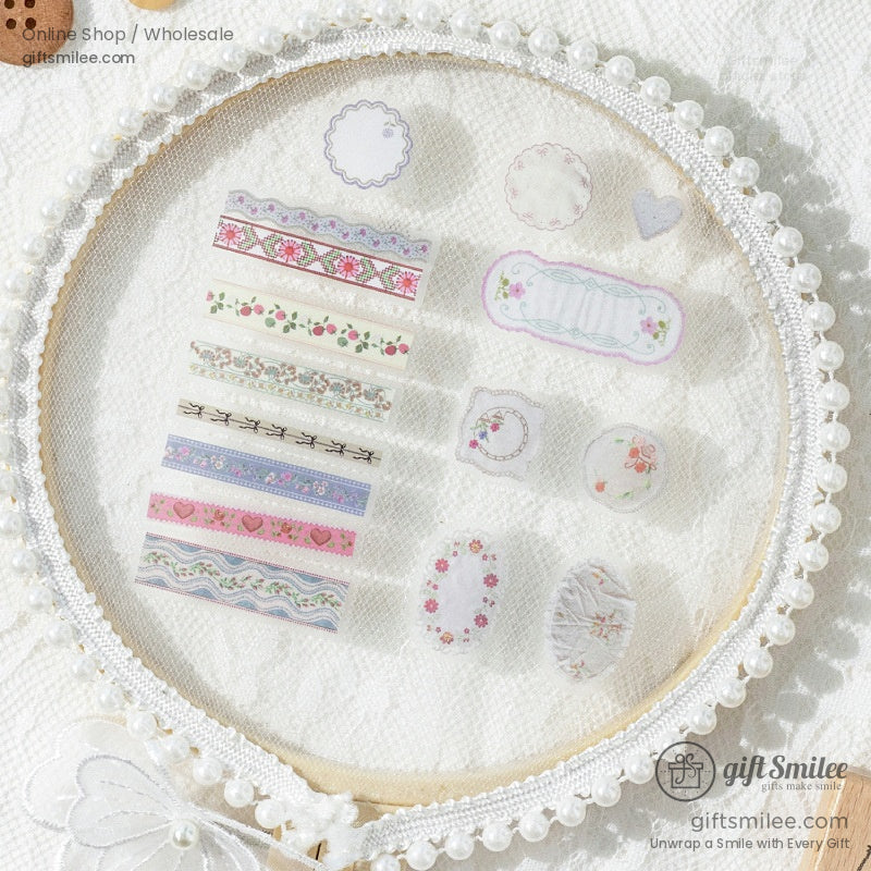 Assorted floral and lace-patterned washi tape displayed in a pearl-framed embroidery hoop