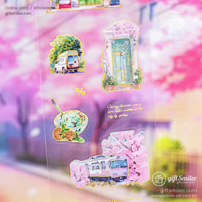 Transparent washi stickers showcasing cherry blossom scenes, a vintage van, and a rustic door in soft pastel tones