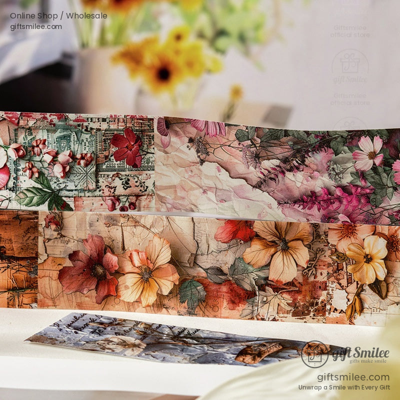 Strips of botanical washi tape featuring vintage flowers on a desk setup