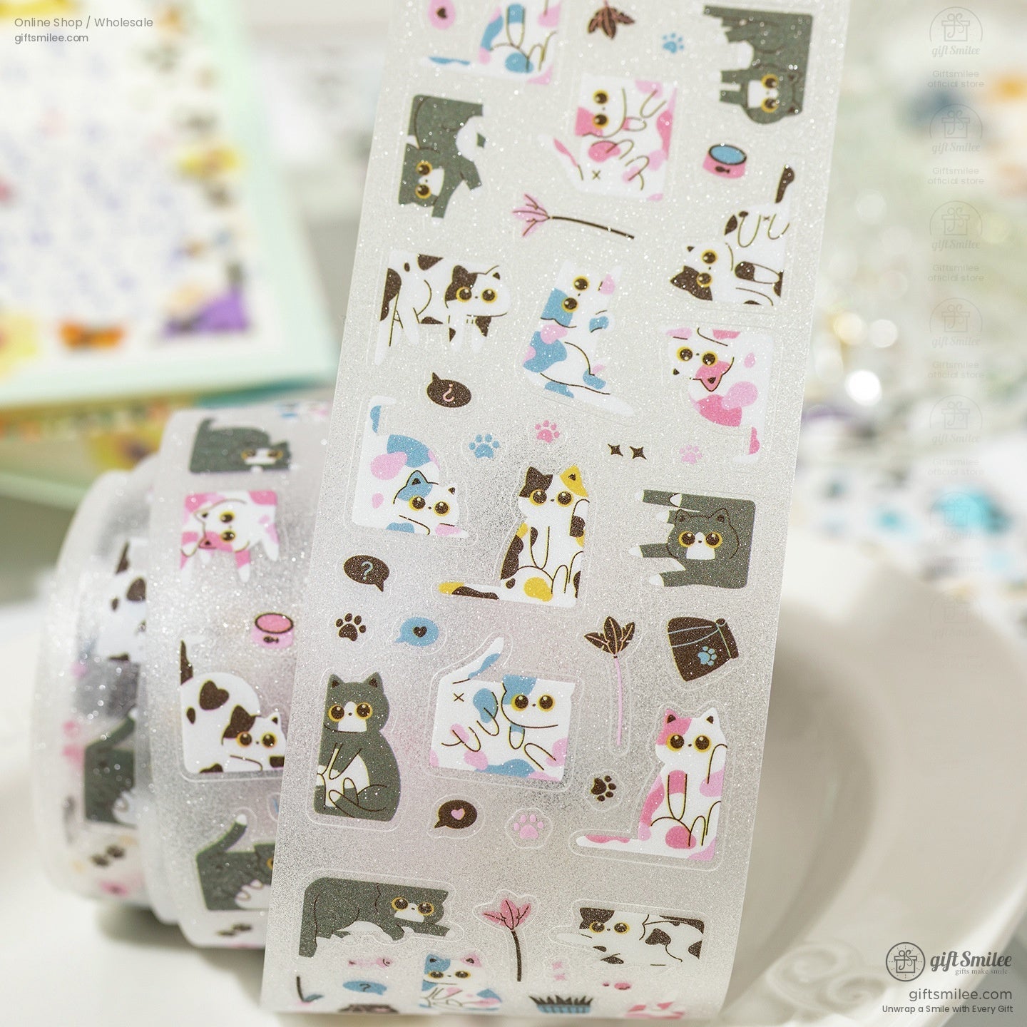 Glittery washi tape roll with adorable cat illustrations and paw prints